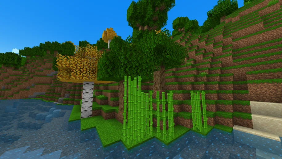 Minecraft river bed with orange birch tree, oak trees and sugar cane with New Default+ texture pack